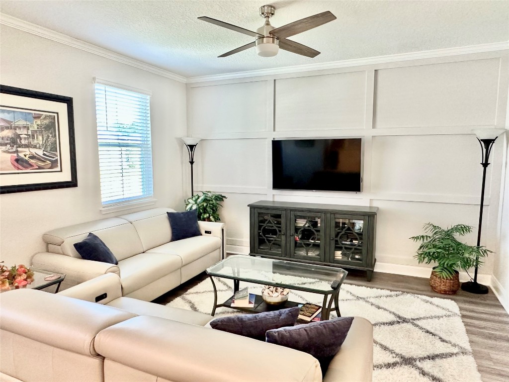 323 Sweetgum Street Yulee, FL 32097 - Photo 6 of 29 a living room with furniture and a flat screen tv