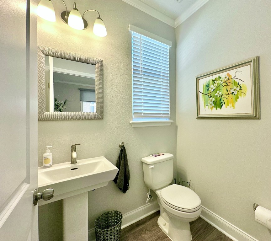 323 Sweetgum Street Yulee, FL 32097 - Photo 8 of 29 a bathroom with a toilet sink and mirror