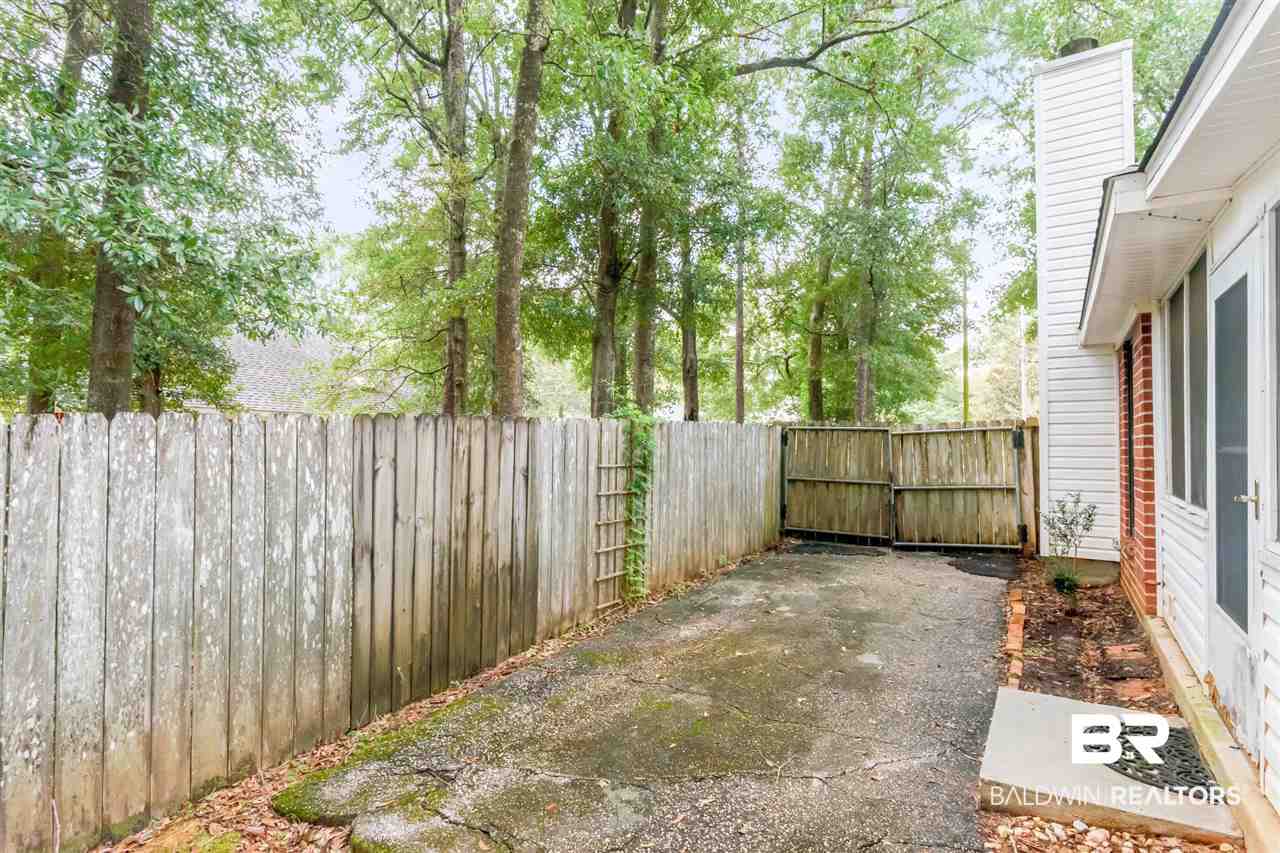 1067 Wesley Avenue Mobile, AL 36609 - Photo 26 of 30 Backyard driveway view