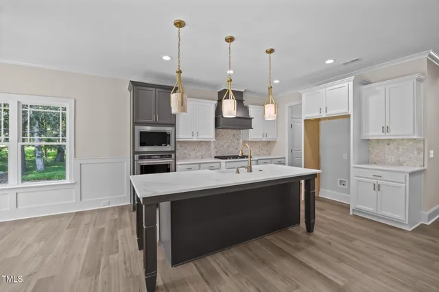 a view of entryway with wooden floor and stairs