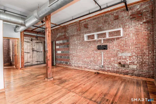 a view of a brick house with an empty space