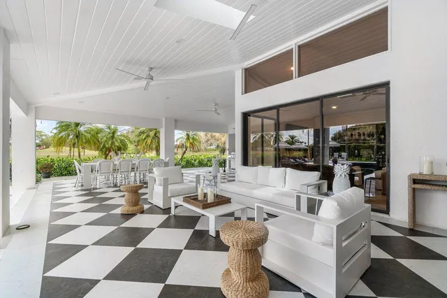 a view of a dining room with furniture wooden floor and windows