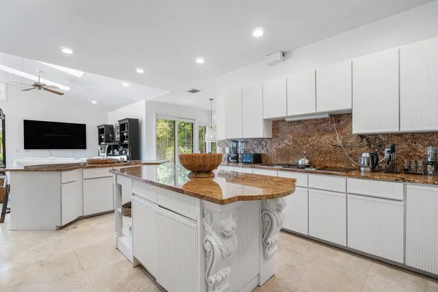 a kitchen with sink cabinets and stainless steel appliances