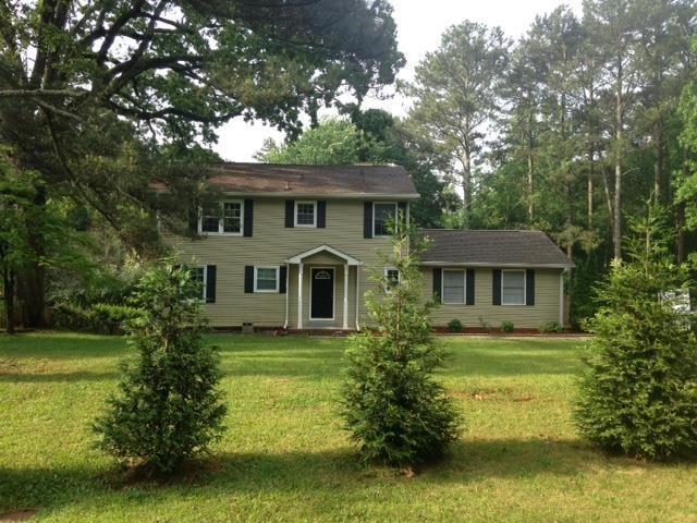 68 Russell Road Lawrenceville, GA 30043 - Photo 1 of 1 Front yard show the home sets back from the road