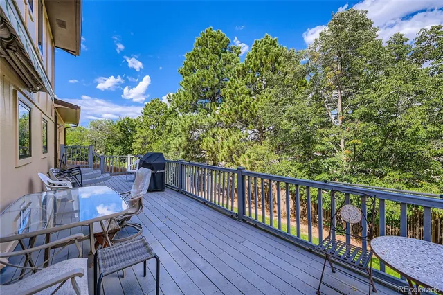 a view of balcony with furniture
