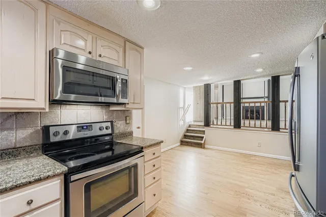 a kitchen with a stove and a microwave