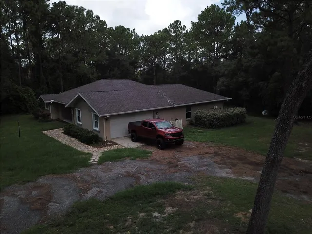 a house with trees in front of it