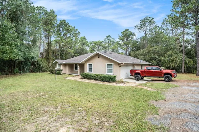 a view of a house with a yard