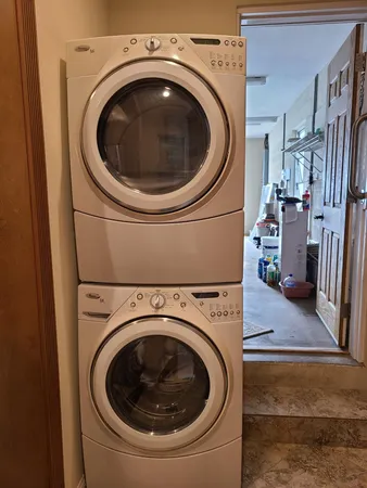 a view of walk in closet with wooden floor