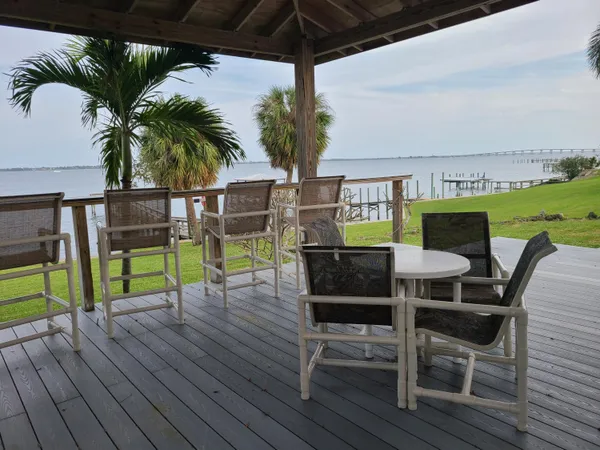 a view of a field with grass and trees
