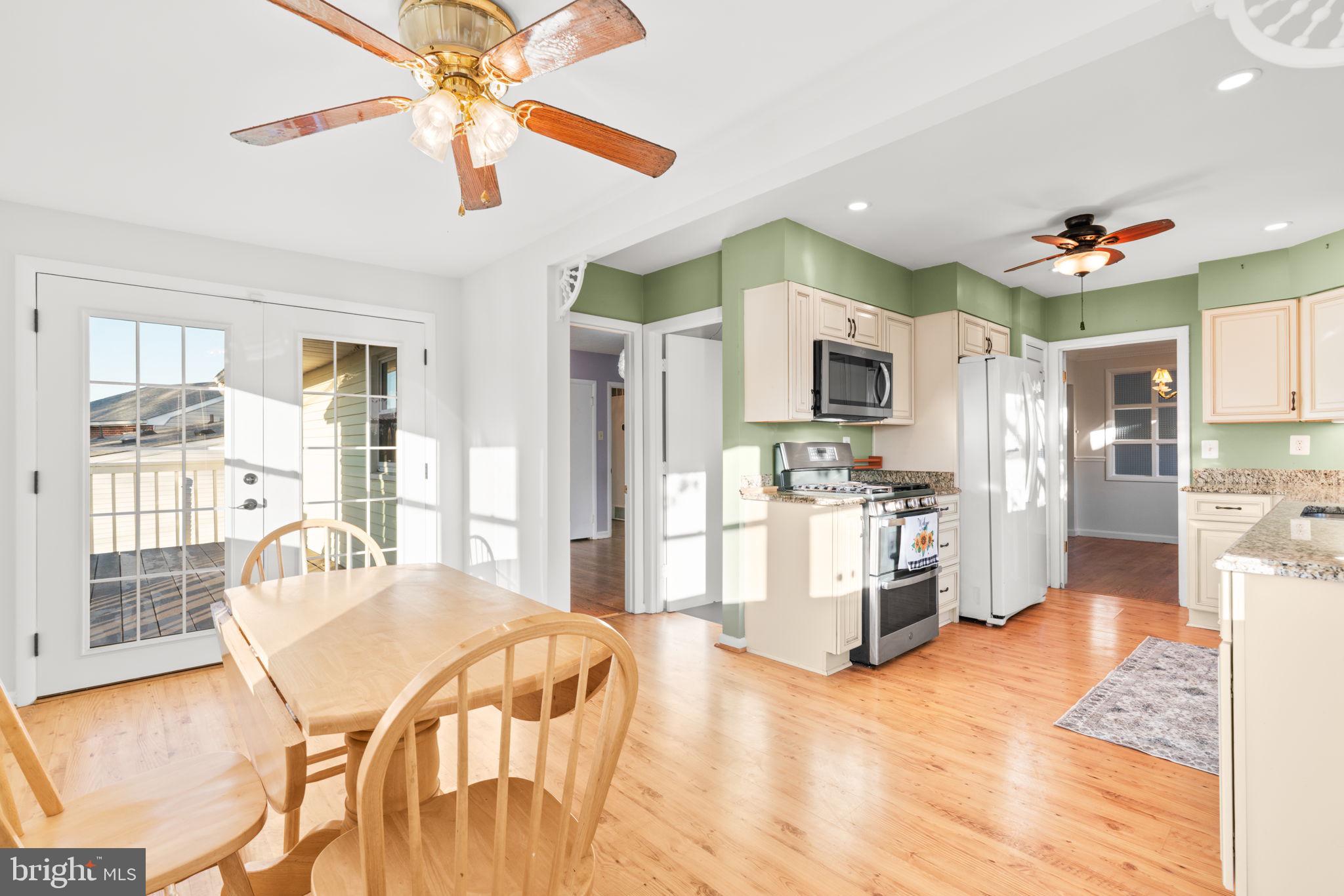 302 Regency Circle Linthicum Heights, MD 21090 - Photo 15 of 33 a kitchen with stainless steel appliances kitchen island granite countertop a refrigerator and microwave
