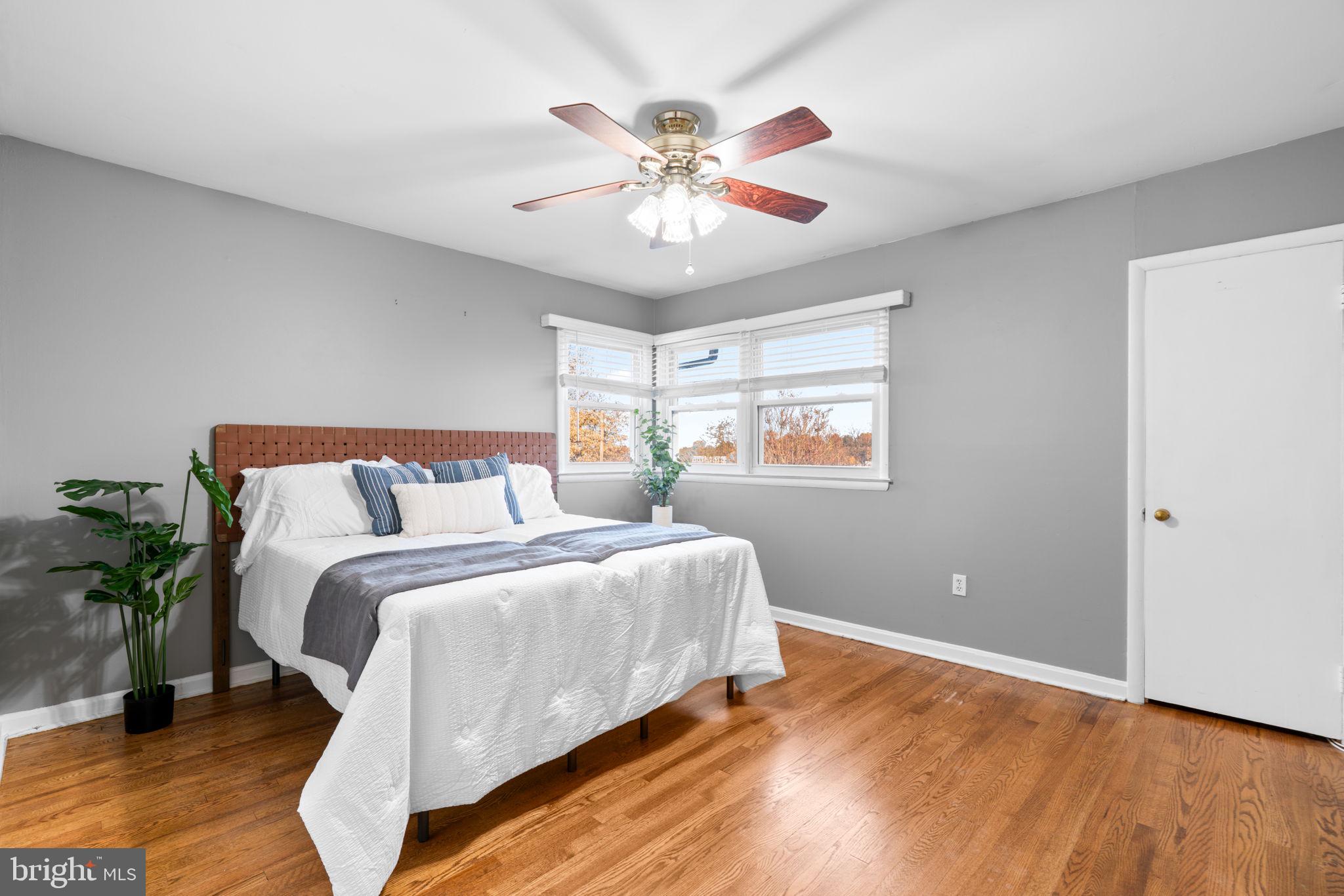 302 Regency Circle Linthicum Heights, MD 21090 - Photo 16 of 33 a bed room with bed and a chandelier