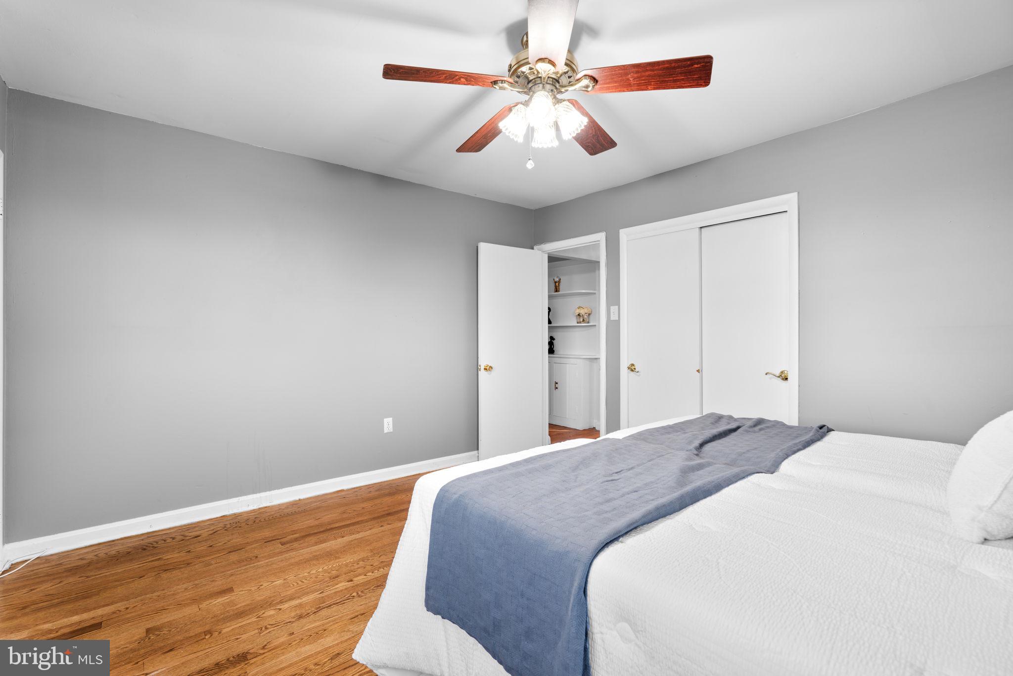 302 Regency Circle Linthicum Heights, MD 21090 - Photo 17 of 33 a bedroom with a large bed and a chandelier