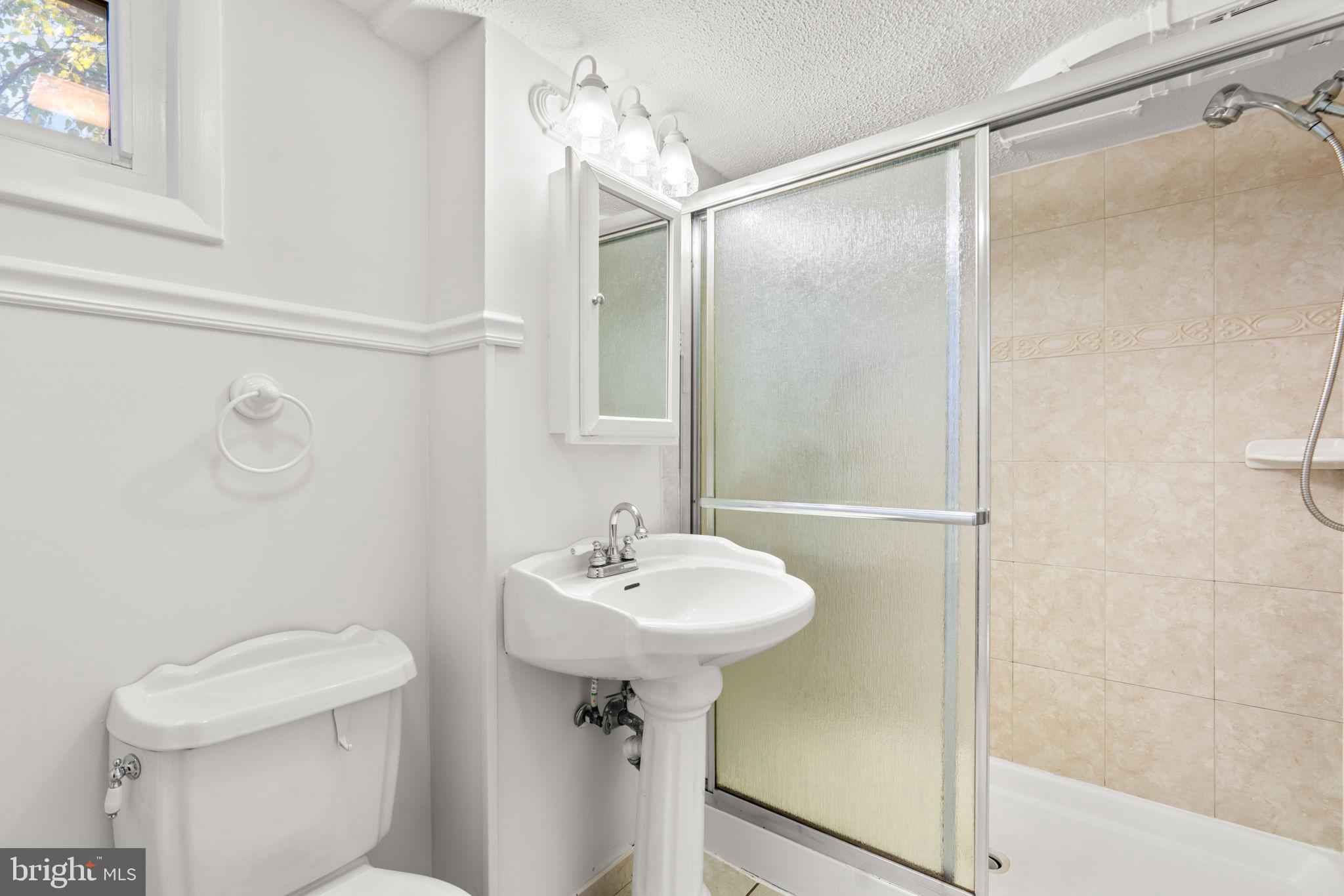 302 Regency Circle Linthicum Heights, MD 21090 - Photo 26 of 33 a bathroom with a sink toilet