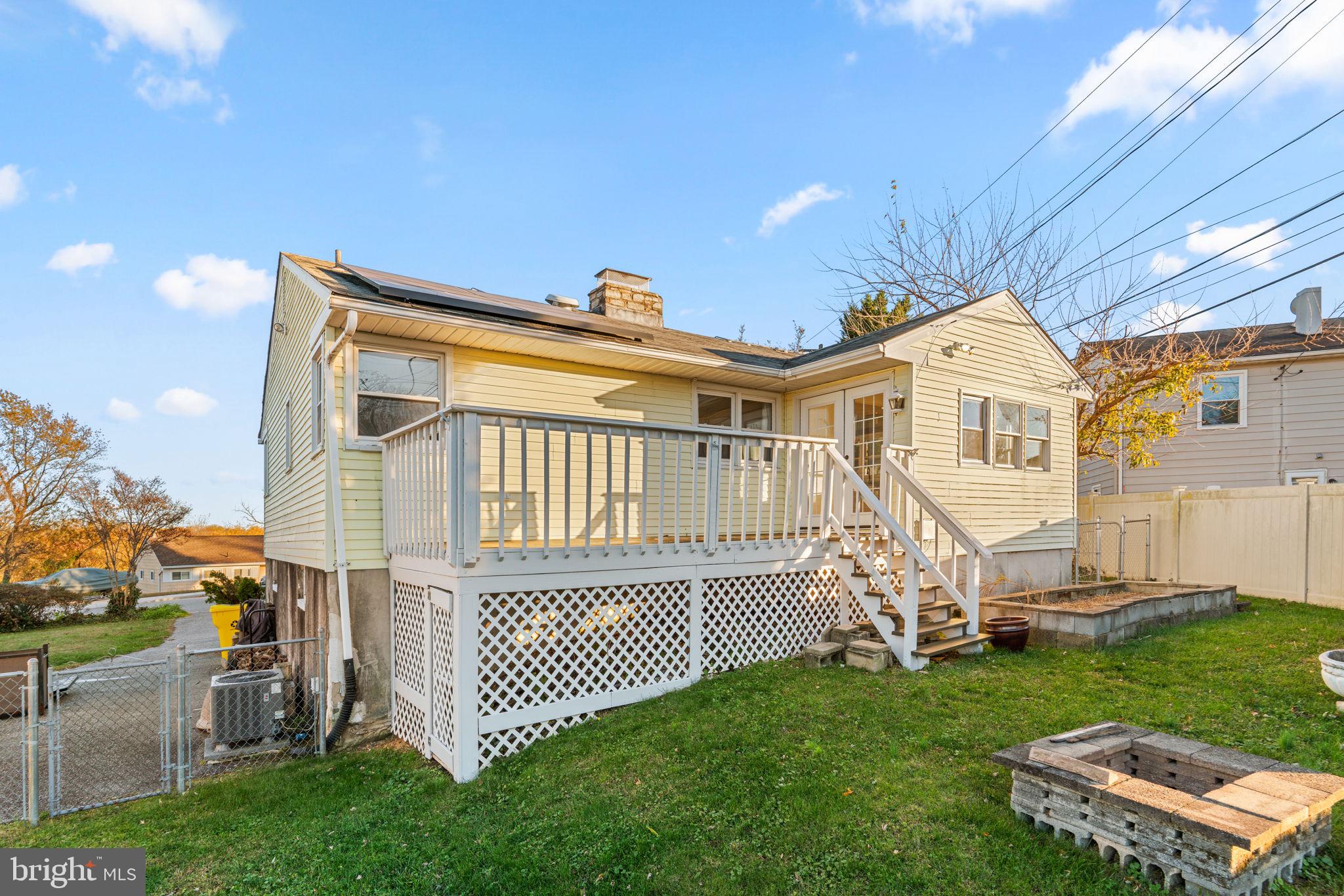 302 Regency Circle Linthicum Heights, MD 21090 - Photo 29 of 33 a front view of a house with a garden