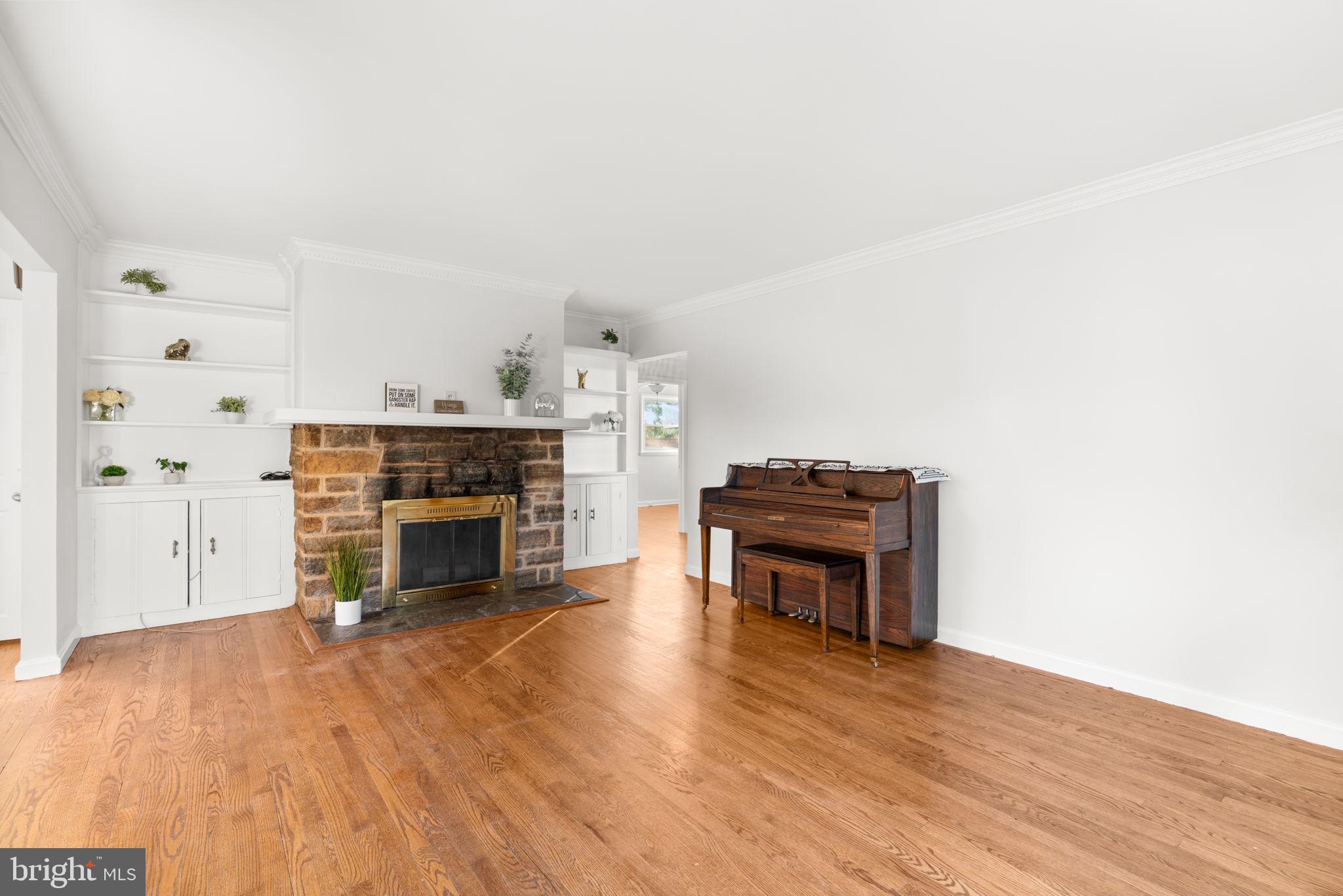 302 Regency Circle Linthicum Heights, MD 21090 - Photo 5 of 33 a living room with furniture and a fireplace