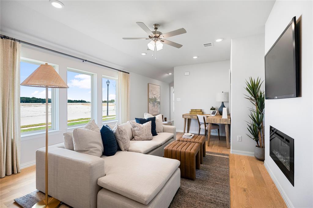 8716 Saratoga Street Pilot Point, TX 76258 - Photo 5 of 16 a living room with furniture and a flat screen tv