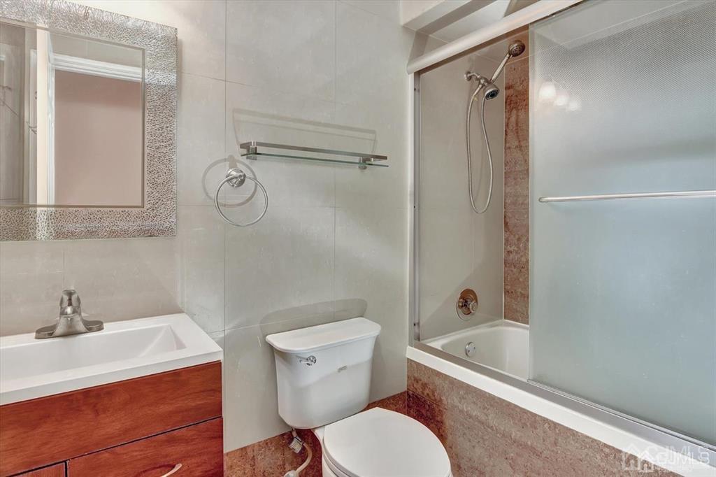 136 Redpine Loop Old Bridge, NJ 08857 - Photo 14 of 22 a white toilet sitting next to a bath tub