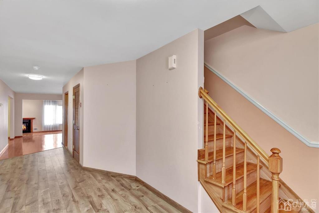 136 Redpine Loop Old Bridge, NJ 08857 - Photo 2 of 22 a view of entryway and hall with wooden floor