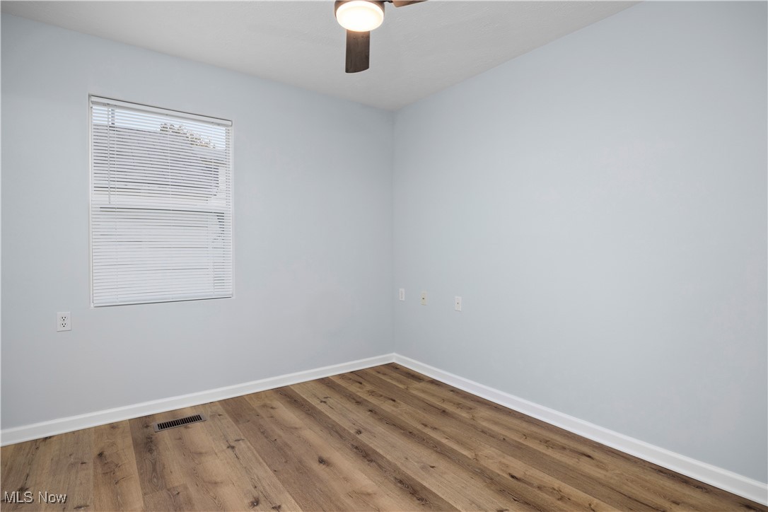 4341 Laurel Road Lorain, OH 44055 - Photo 10 of 36 Empty room with ceiling fan and hardwood / wood-style flooring