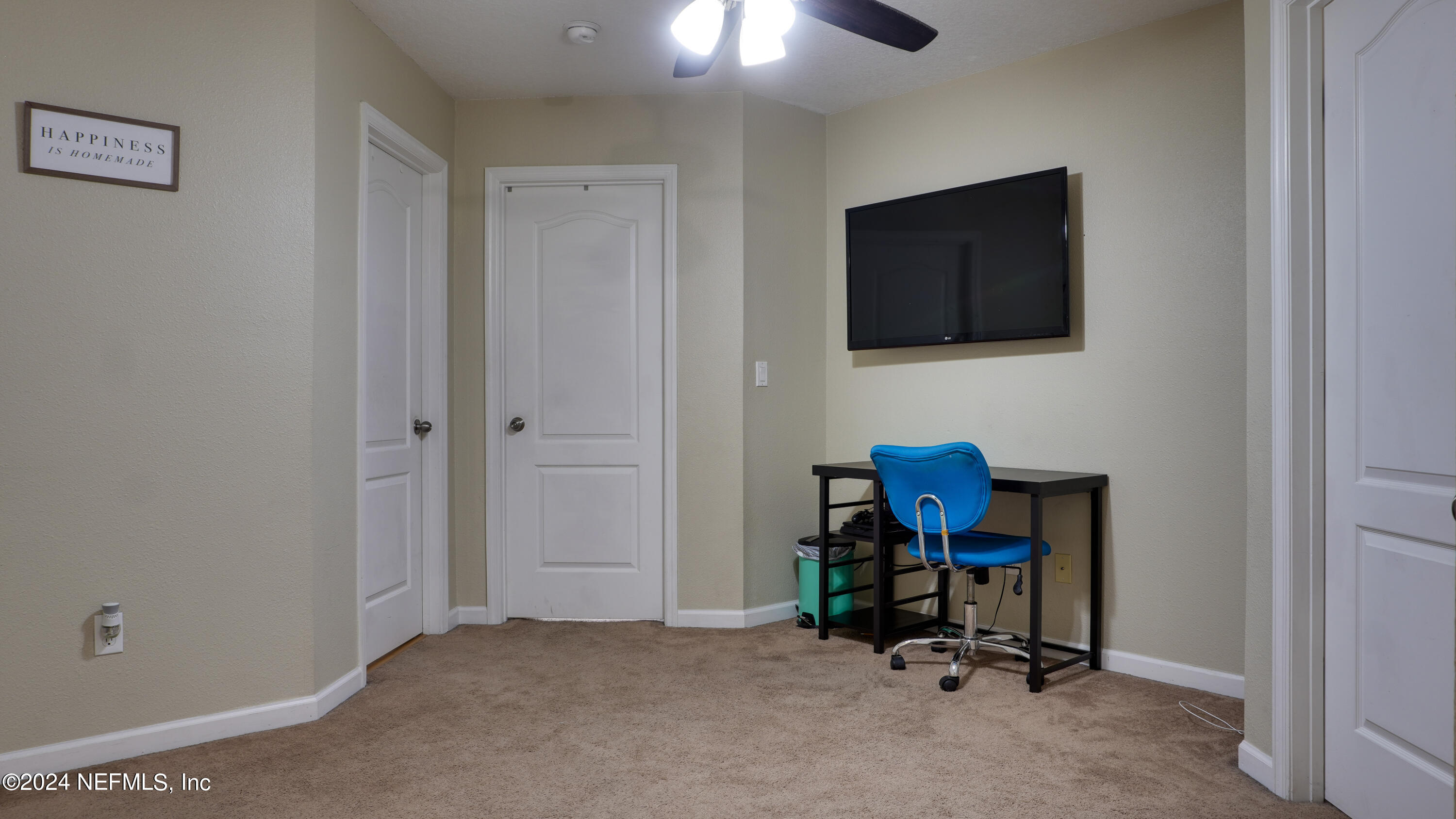 3838 Chasing Falls Road Orange Park, FL 32065 - Photo 11 of 33 a room with furniture and a flat screen tv