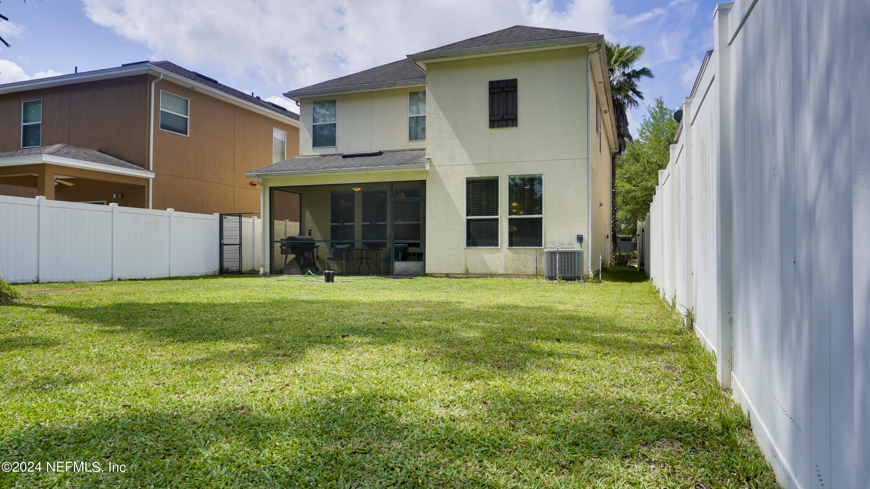 3838 Chasing Falls Road Orange Park, FL 32065 - Photo 14 of 33 a view of a backyard with plants and large tree
