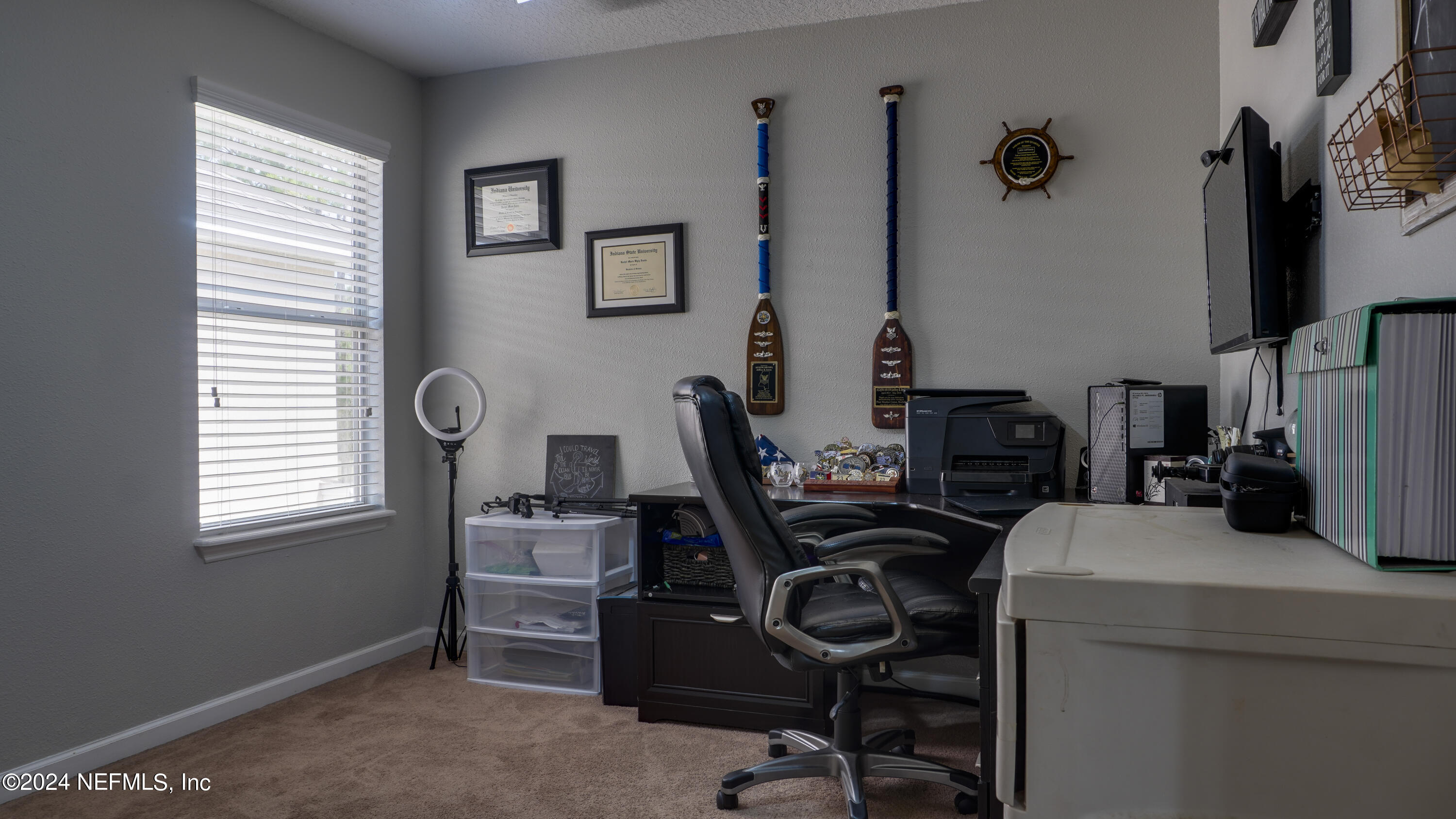 3838 Chasing Falls Road Orange Park, FL 32065 - Photo 19 of 33 a view of a workspace with furniture and a window