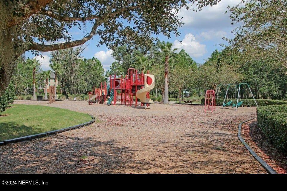 3838 Chasing Falls Road Orange Park, FL 32065 - Photo 33 of 33 a view of outdoor space with playground and green space