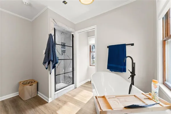 a bedroom with furniture and a window