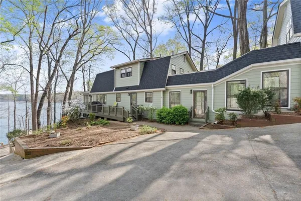 a view of a house with trees in the background
