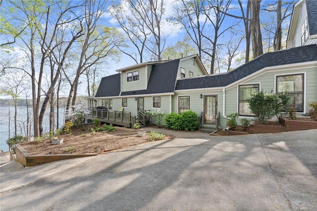 103 Tugalo Point Lavonia, GA 30553 - Photo 3 of 70 a view of a house with trees in the background