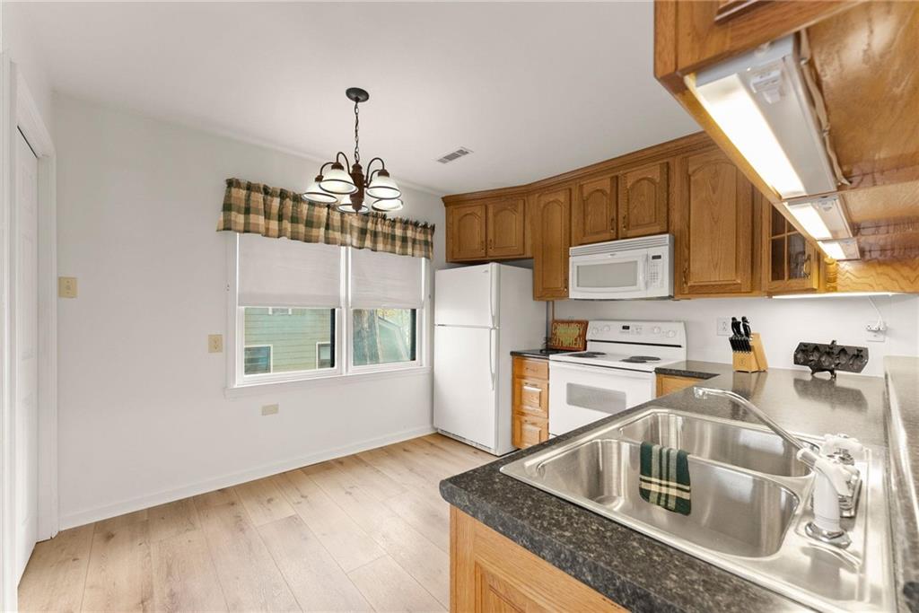 103 Tugalo Point Lavonia, GA 30553 - Photo 43 of 70 a kitchen that has a sink a window and stainless steel appliances