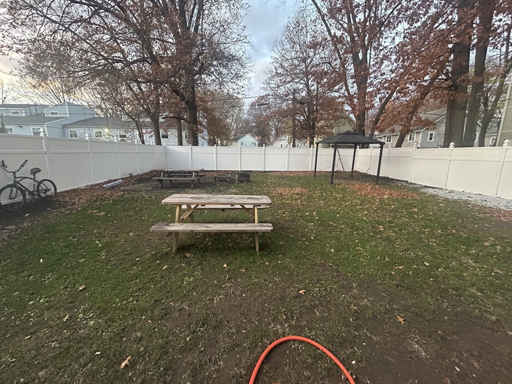 62 Washburn Street Springfield, MA 01107 - Photo 14 of 16 a backyard of a house with lots of green space