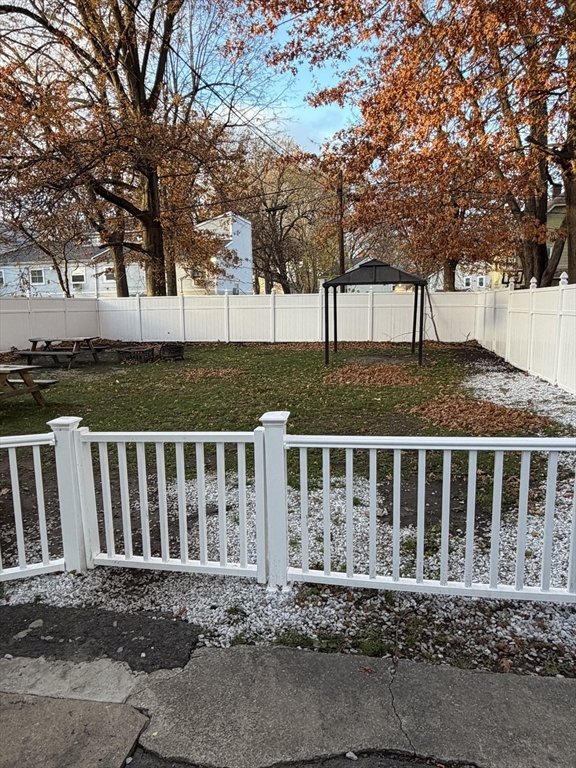 62 Washburn Street Springfield, MA 01107 - Photo 15 of 16 a front view of a house with a yard