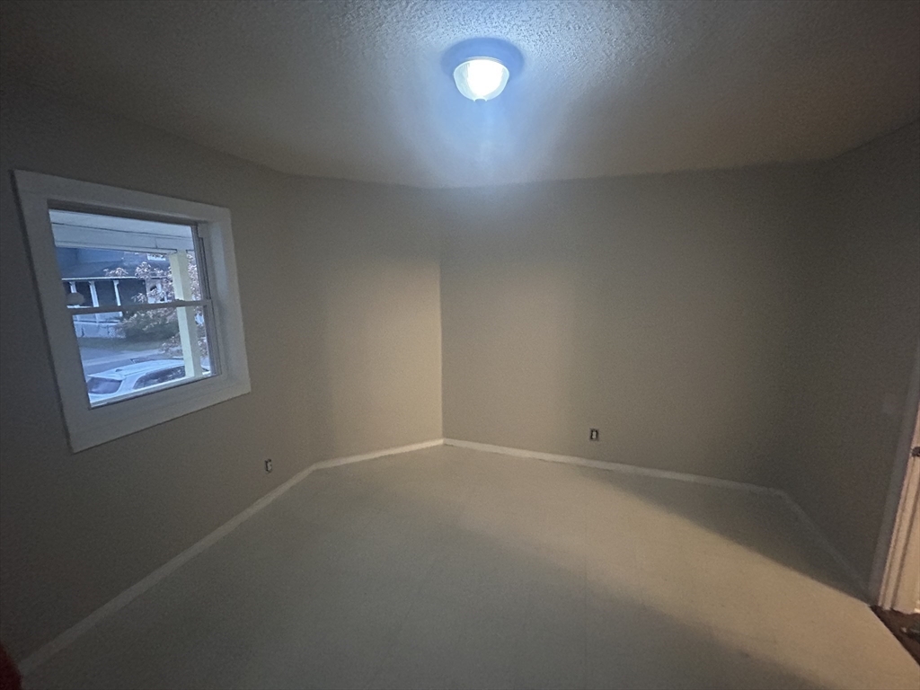 62 Washburn Street Springfield, MA 01107 - Photo 7 of 16 an empty room with a window