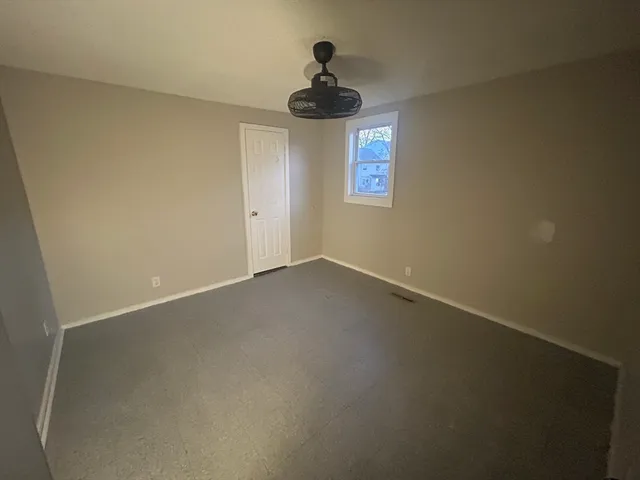 a view of a hallway with a window