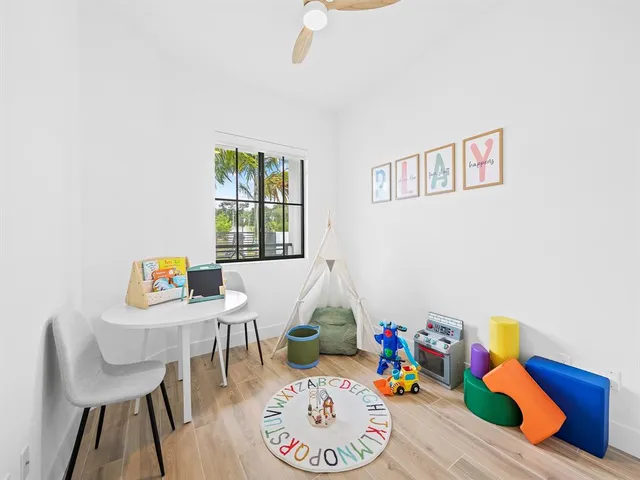 a spacious bedroom with a bed and a couch