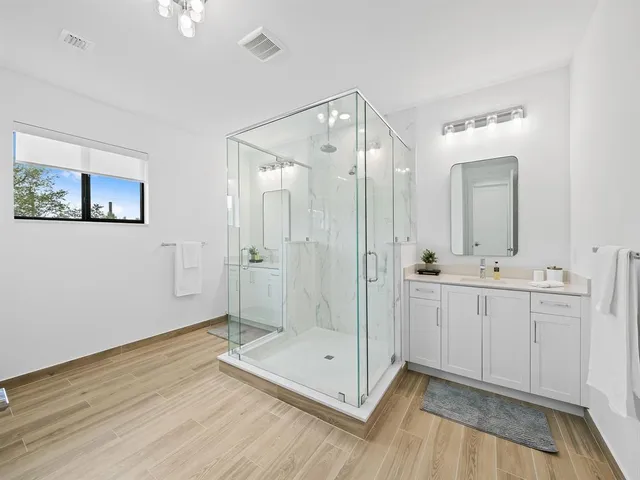 a living room with a bed furniture and a window