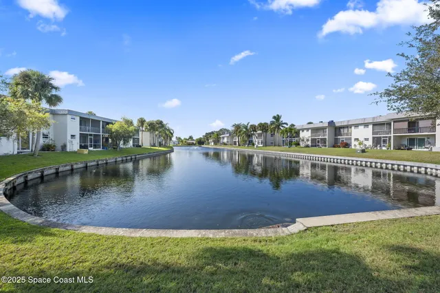 a view of a lake with a house in the background