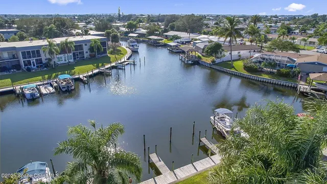 an aerial view of a house with a lake view