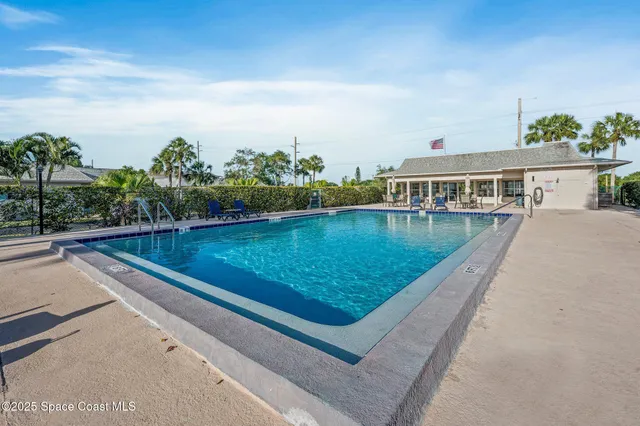 a view of swimming pool from a balcony