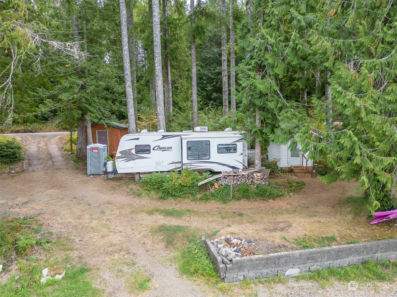 12630 West Shelton Matlock Road Shelton, WA 98584 - Photo 21 of 25 a backyard of a house with yard and outdoor seating