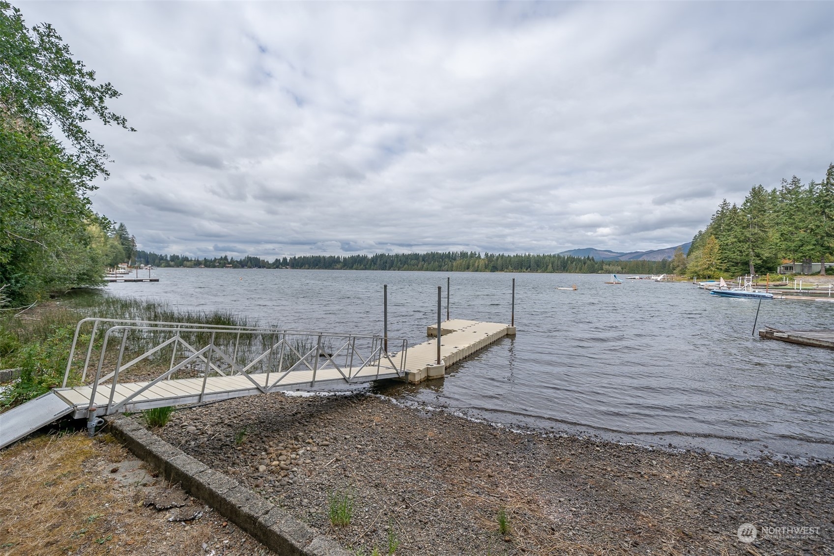 12630 West Shelton Matlock Road Shelton, WA 98584 - Photo 22 of 25 a view of a lake with houses in the back