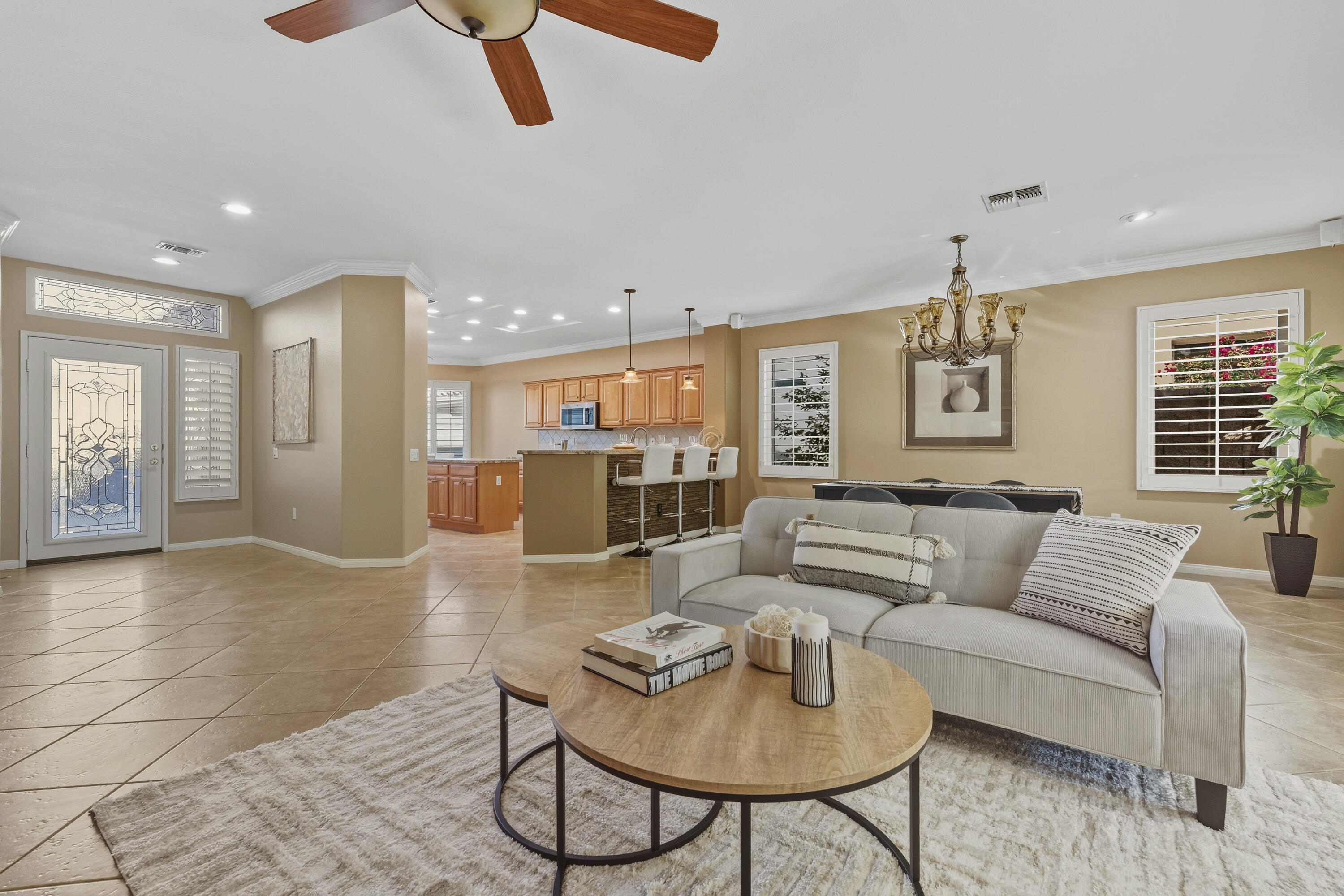 78589 Rainswept Way Palm Desert, CA 92211 - Photo 12 of 30 a living room with furniture and a table