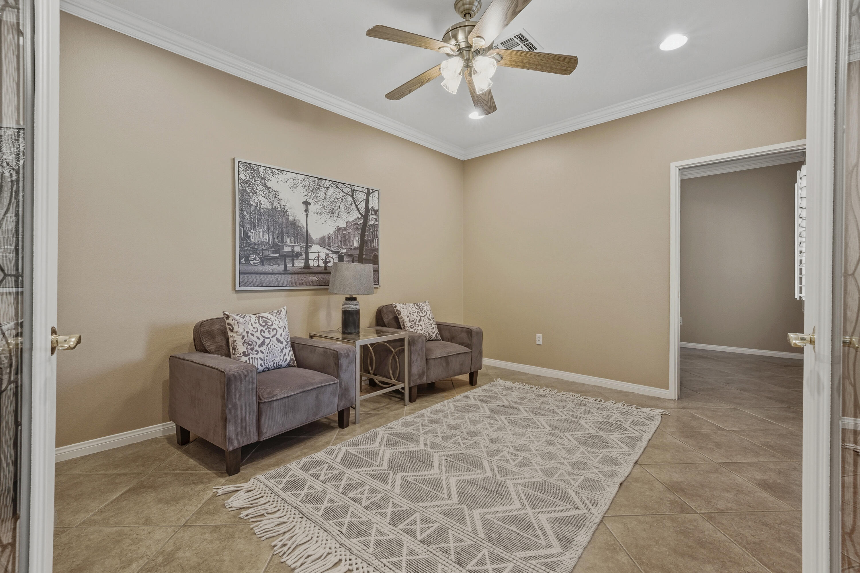 78589 Rainswept Way Palm Desert, CA 92211 - Photo 18 of 30 a living room with furniture and a chandelier
