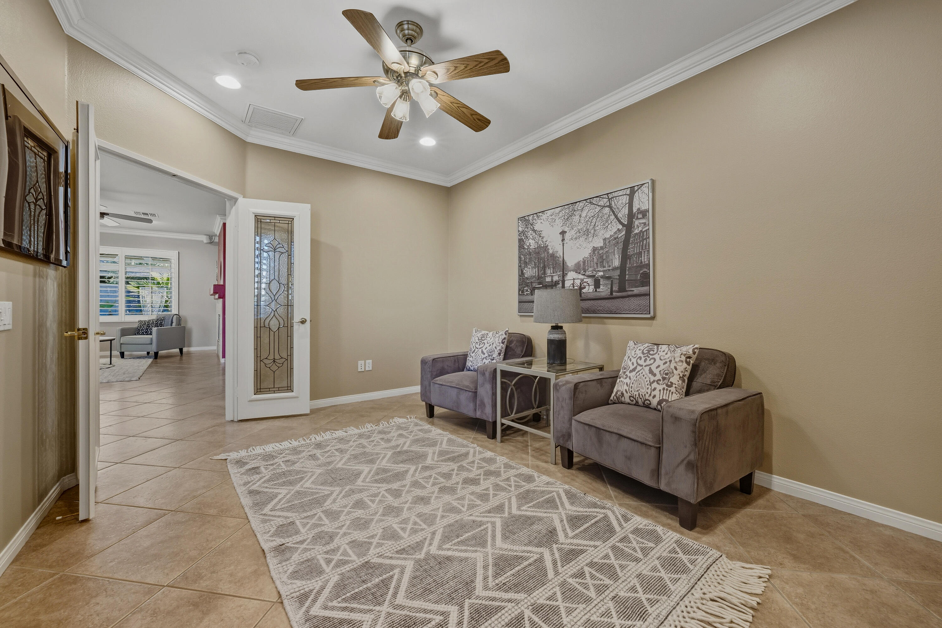 78589 Rainswept Way Palm Desert, CA 92211 - Photo 19 of 30 a living room with furniture and a chandelier