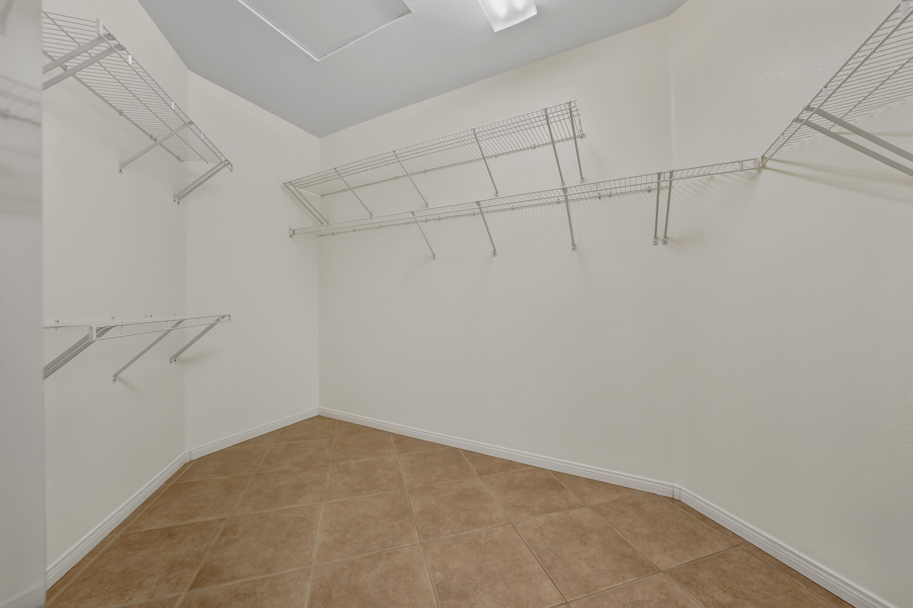 78589 Rainswept Way Palm Desert, CA 92211 - Photo 23 of 30 a view of a room with racks on the wall