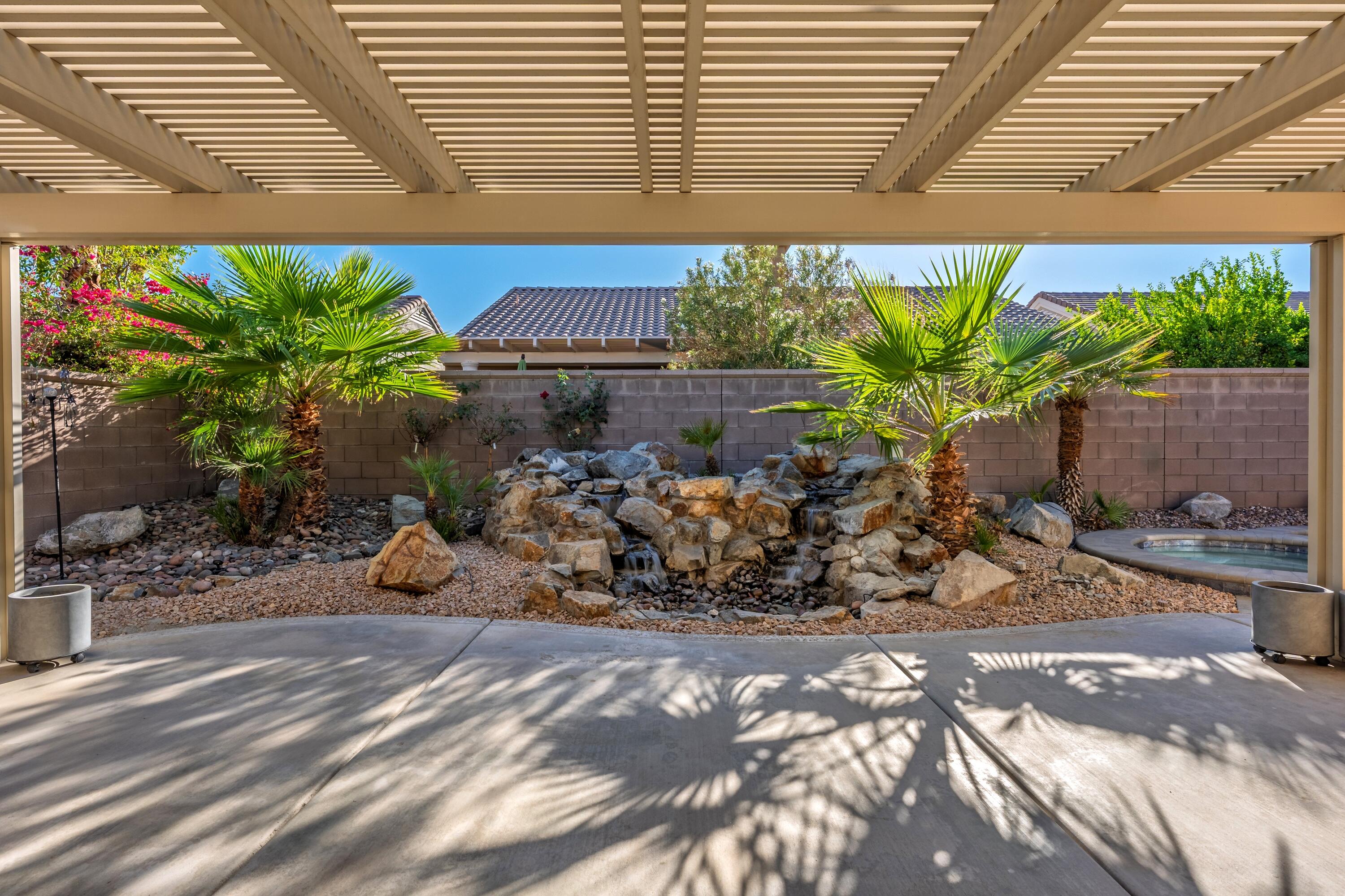 78589 Rainswept Way Palm Desert, CA 92211 - Photo 30 of 30 a view of a chairs and table in a backyard
