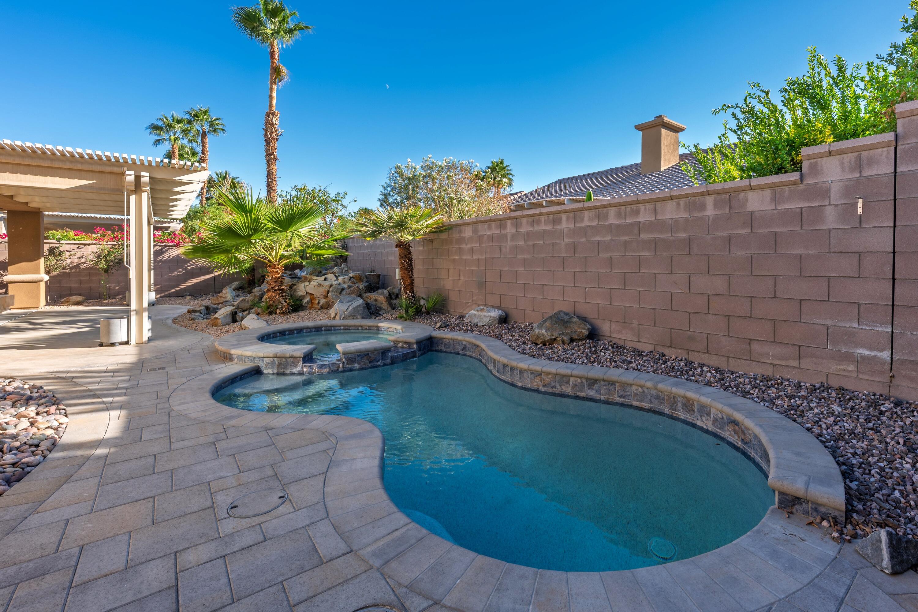 78589 Rainswept Way Palm Desert, CA 92211 - Photo 5 of 30 a view of a swimming pool with lounge chair
