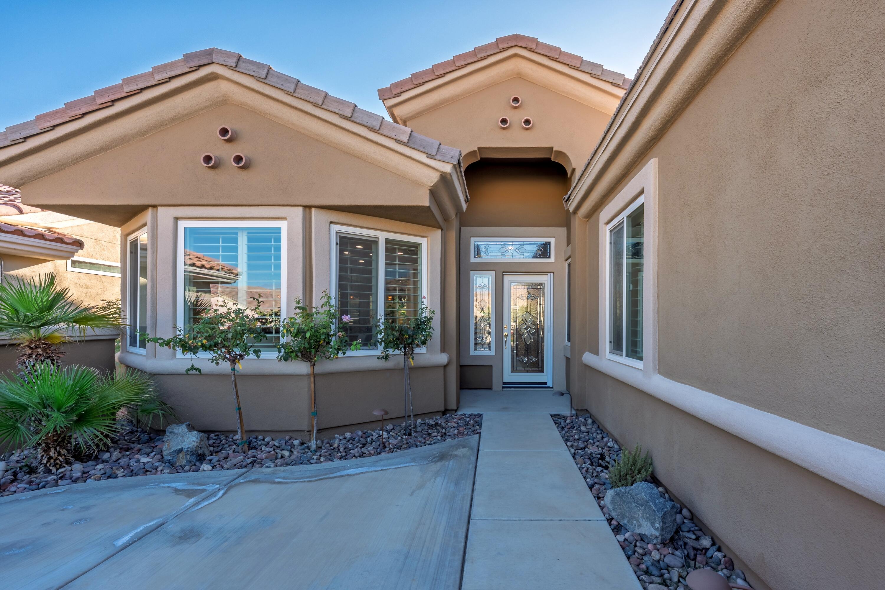 78589 Rainswept Way Palm Desert, CA 92211 - Photo 7 of 30 a front view of a house with entryway